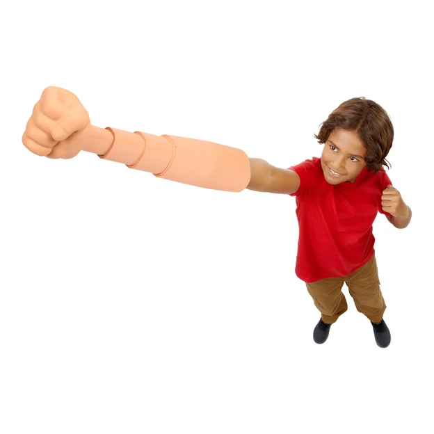 A young boy punching his arm with the One Piece Gum Gum Punch Arm toy.