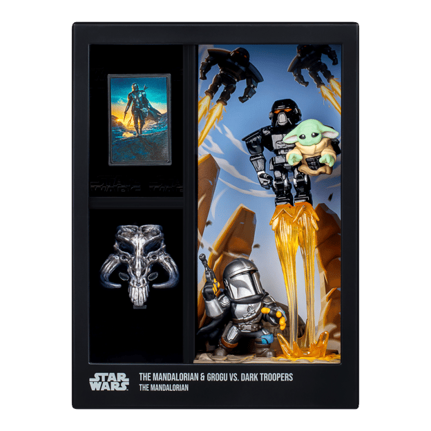 Grogu & Mando Vs The Dark Troopers figures in display box. The display features a comic book cover and a silver artifact.