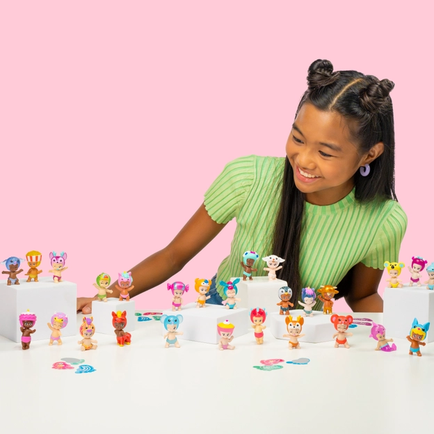 Teenage girl looking at assorted Bibi-Chibi's toys.