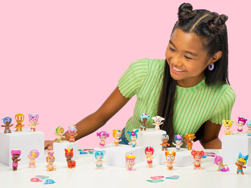 Teenage girl looking at assorted Bibi-Chibi's toys.