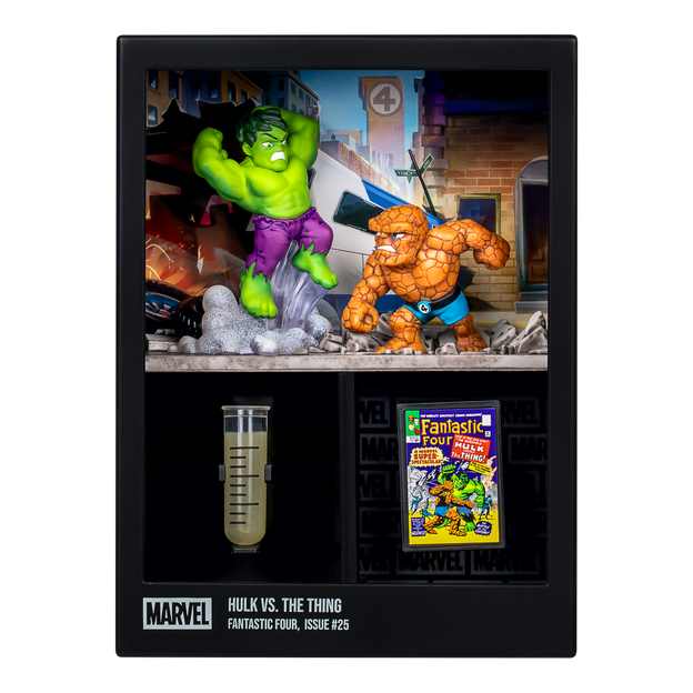 Hulk Vs The Thing figures in display box. Alongside a test tube with clear/yellow liquid inside as well as a fantastic four colorful card.