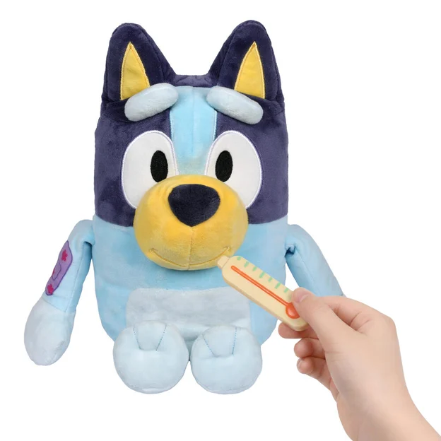 Bluey plush with a hand taking its temperature.