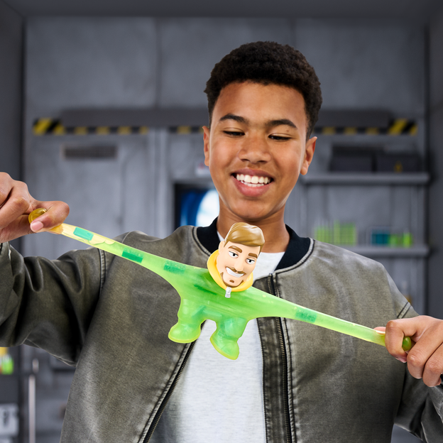Young teen pulling the MrBeast Lab creation toy as far out as possible. 