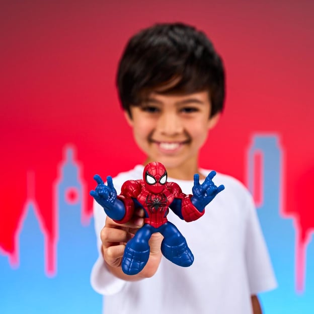 Young boy holding a Marvel Goo Jitzu spiderman toy.