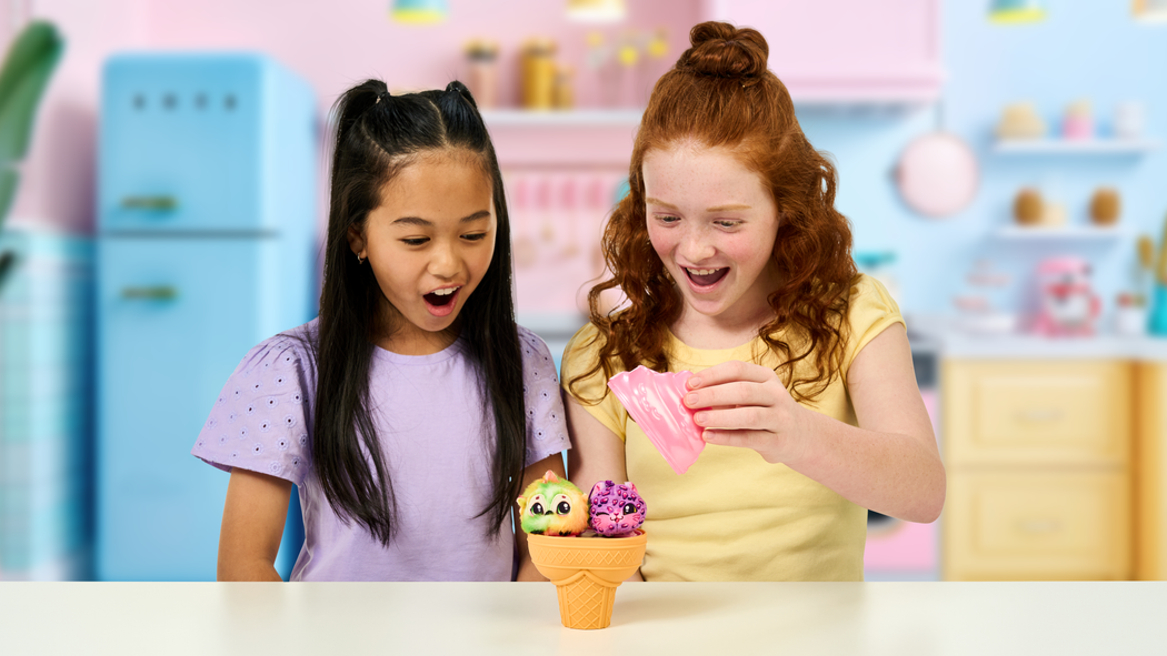Two girls surprised while opening their Yum Yumz 2 Pack toy.