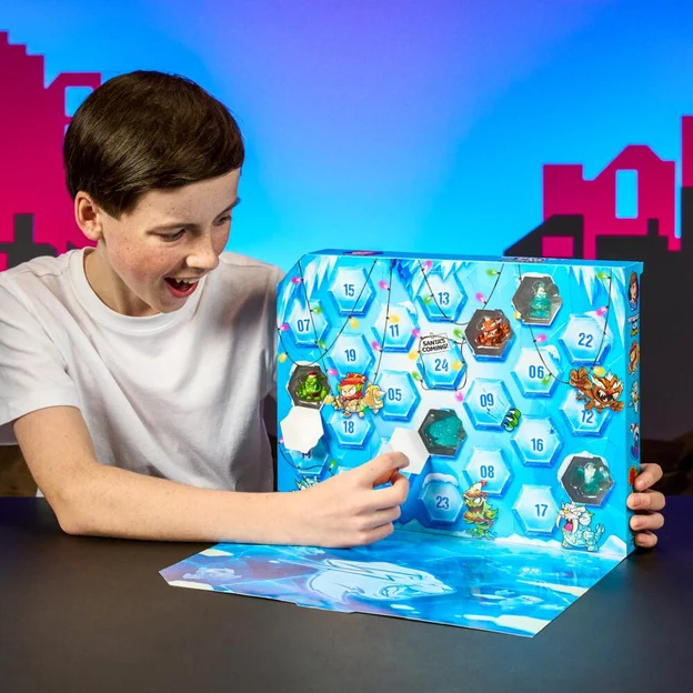 Young bouy opening up his MrBeast Lab Swarms advent calendar.
