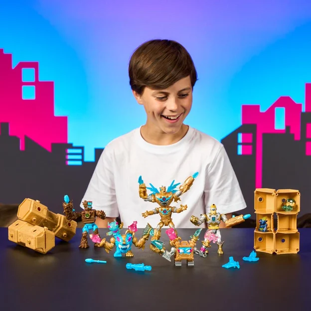 Young boy looking at his MrBeast Lab Mega Tech mystery pack toys collection.
