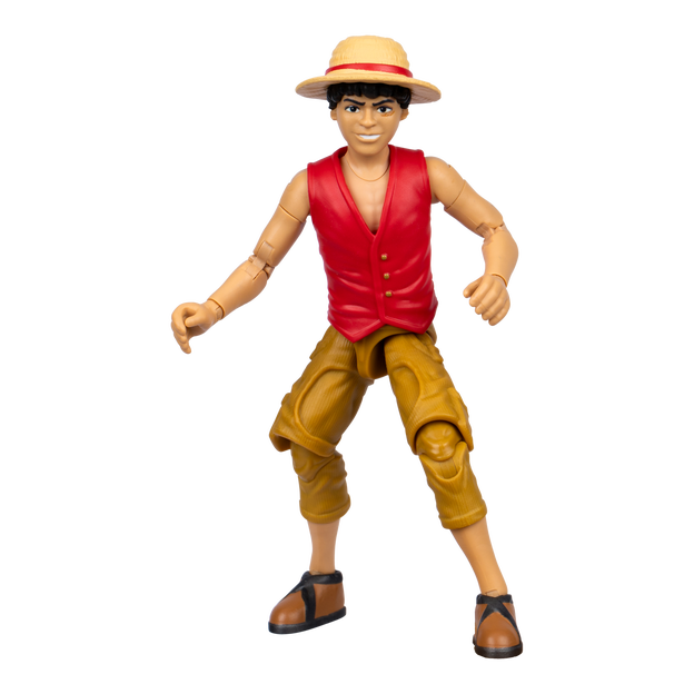 Close up of mini action figure. It is a boy with a red vest, wide brimmed hat, brown hat and brown shoes.