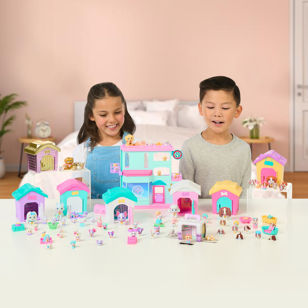 Young boy and girl looking at the Mama Surprise Family collection. 