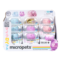 Variety of micropets in packaging. Described as your smart pocket-sized petbot. Display shows a blue, gold, pink and light pink versions.