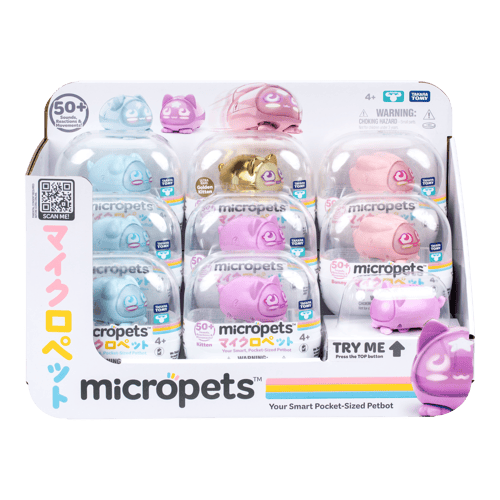 Variety of micropets in packaging. Described as your smart pocket-sized petbot. Display shows a blue, gold, pink and light pink versions.