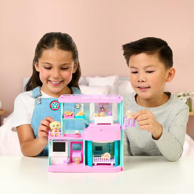 Young boy and girl playing with the Mama Surprise Families Baby Clinic Playset. 