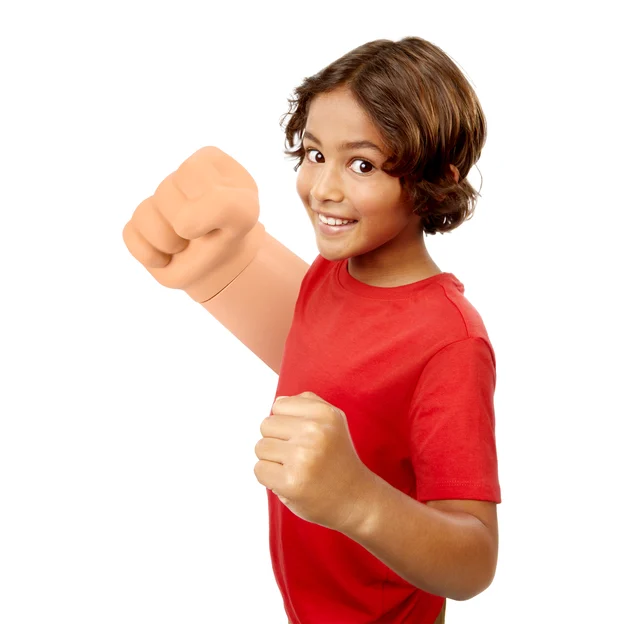 A boy is holding his fist with the One Piece Gum Gum Punch Arm on.