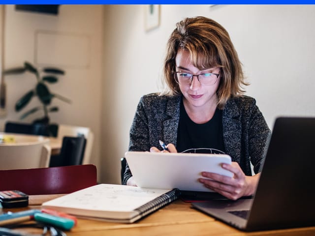 Adult studying on a laptop during a Berlitz online language-learning session.
